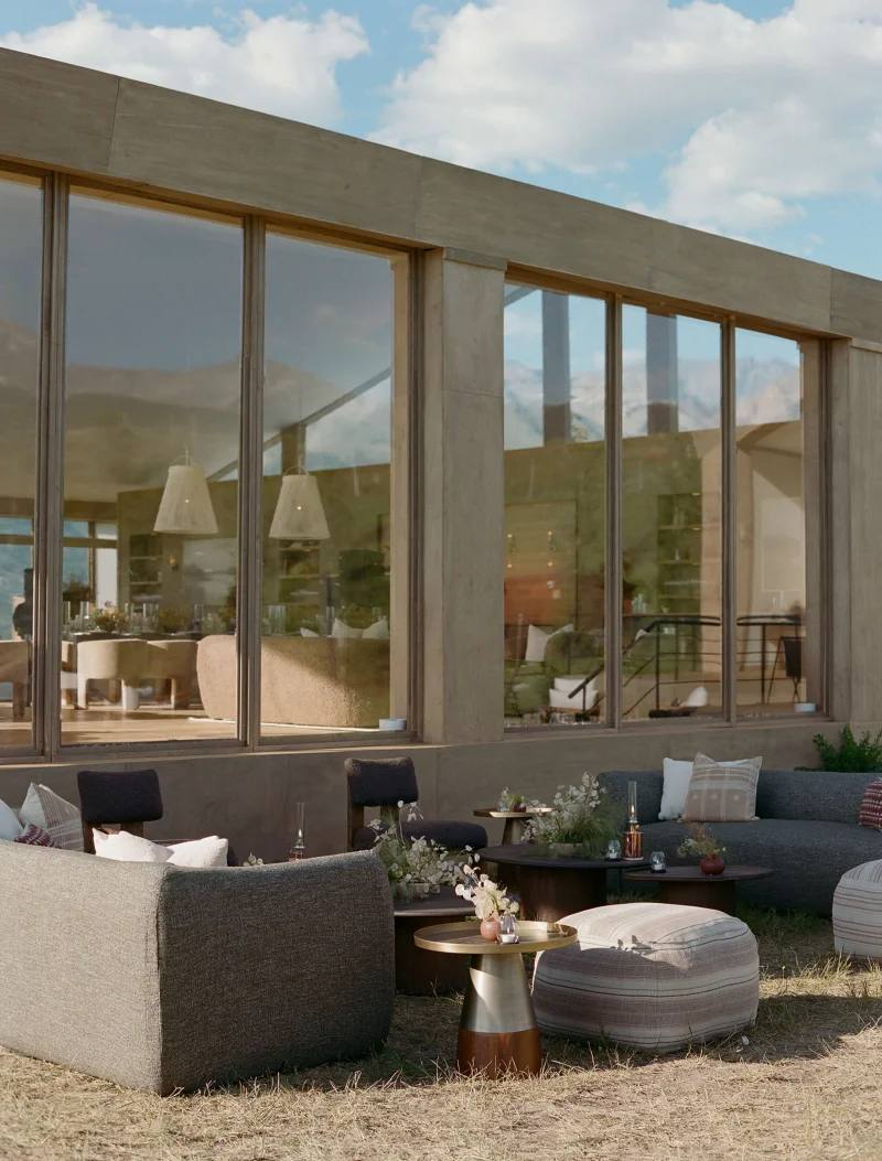 Outdoor lounge and cocktail setting outside a modernist residence